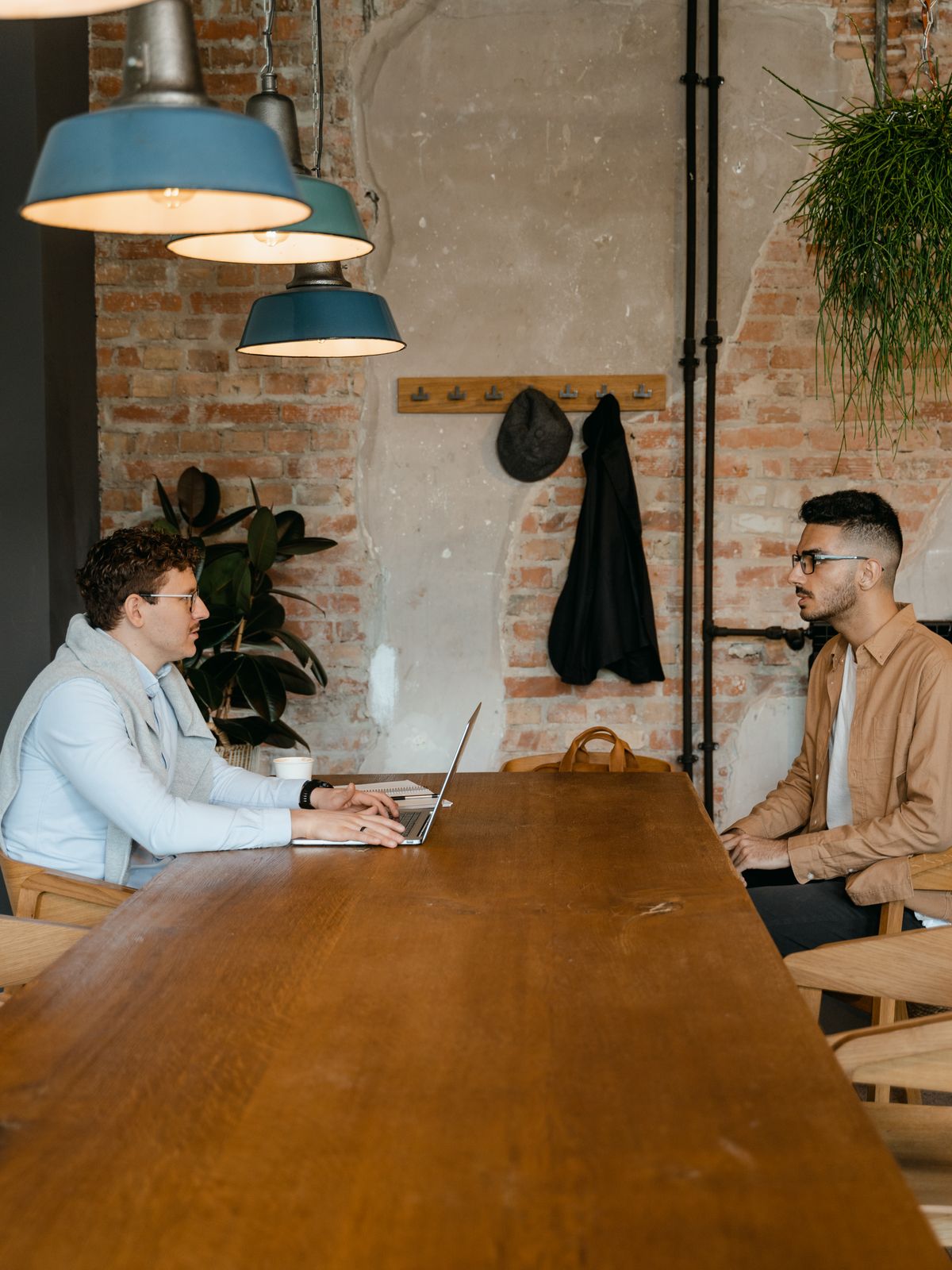Interviewer and candidate talking across a table