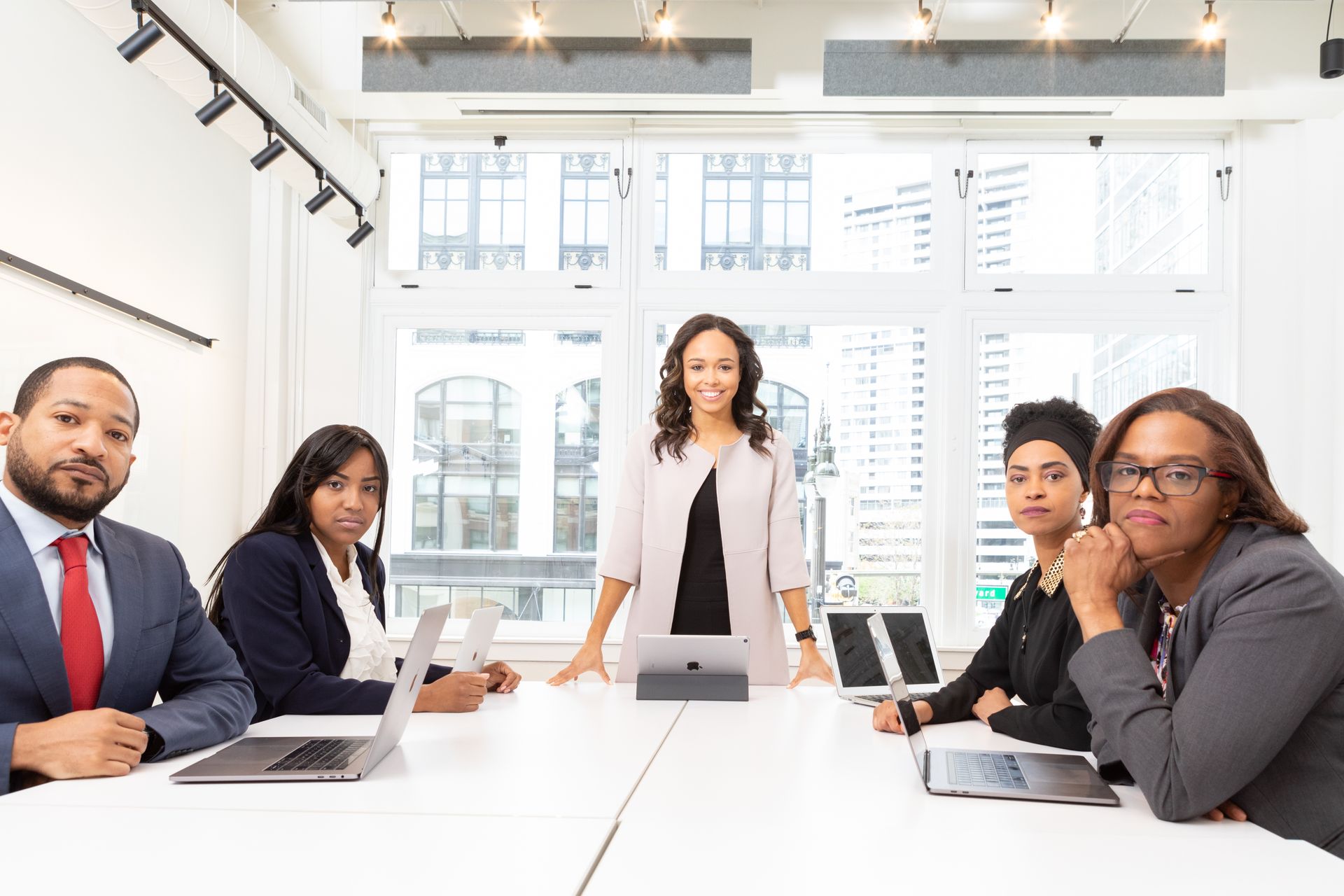 Senior team meeting in a bright boardroom